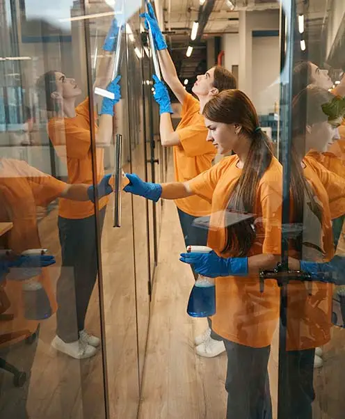 two cleaners clean the large windows of the cowork 2025 03 08 20 48 28 utc